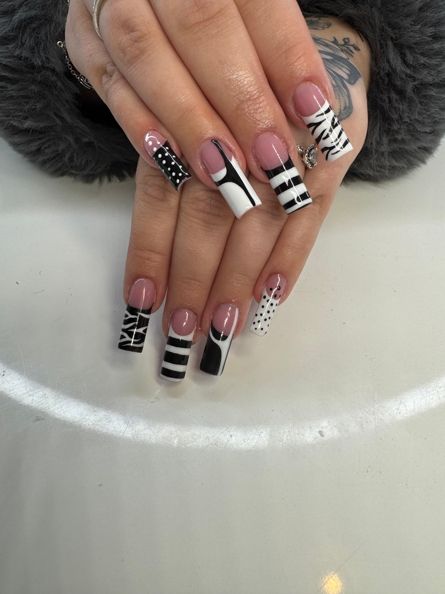 Long coffin French tips in black and white with polka dots, stripes and zebra prints